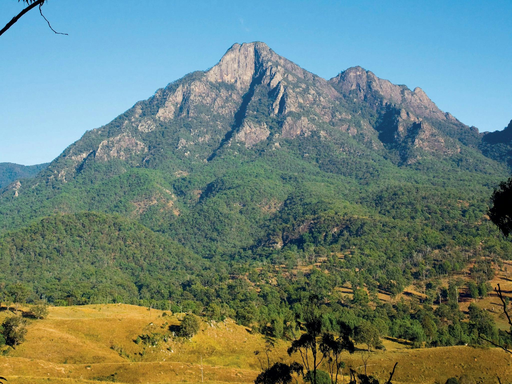 Mount Barney with lower slopes and farmland in foreground. Mount Barney with lower slopes and farmland in foreground.