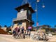 Group of cyclists celebrating conquering the Mt Buller road climb