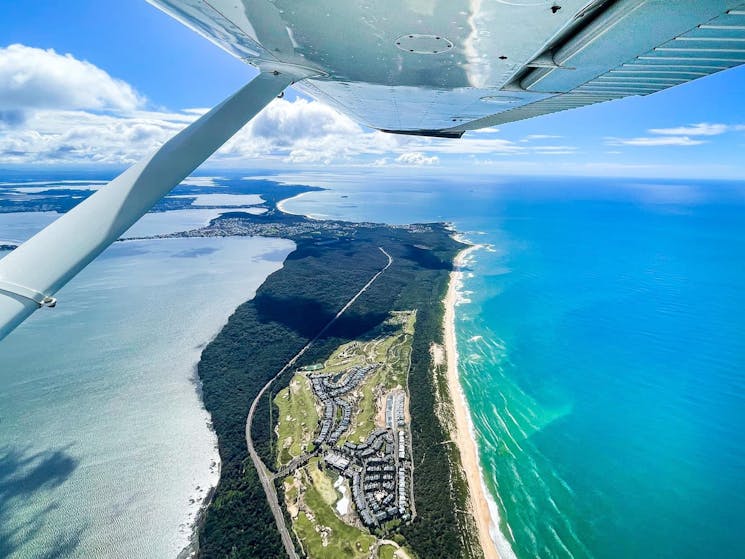 Photo taken from a scenic flight over tuggerah lakes looking north  at Magenta Shores