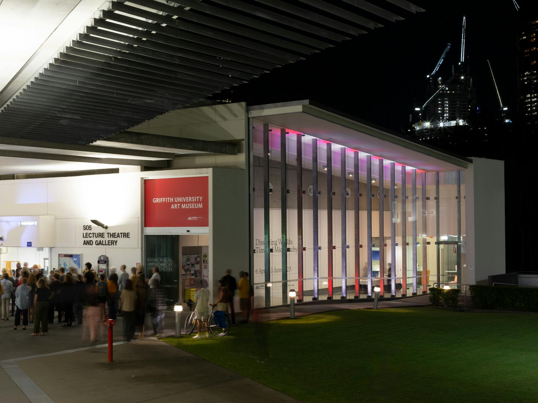 Exterior view of Griffith University Art Museum at nigh, with a large crowd Exterior view of Griffith University Art Museum at nigh, with a large crowd