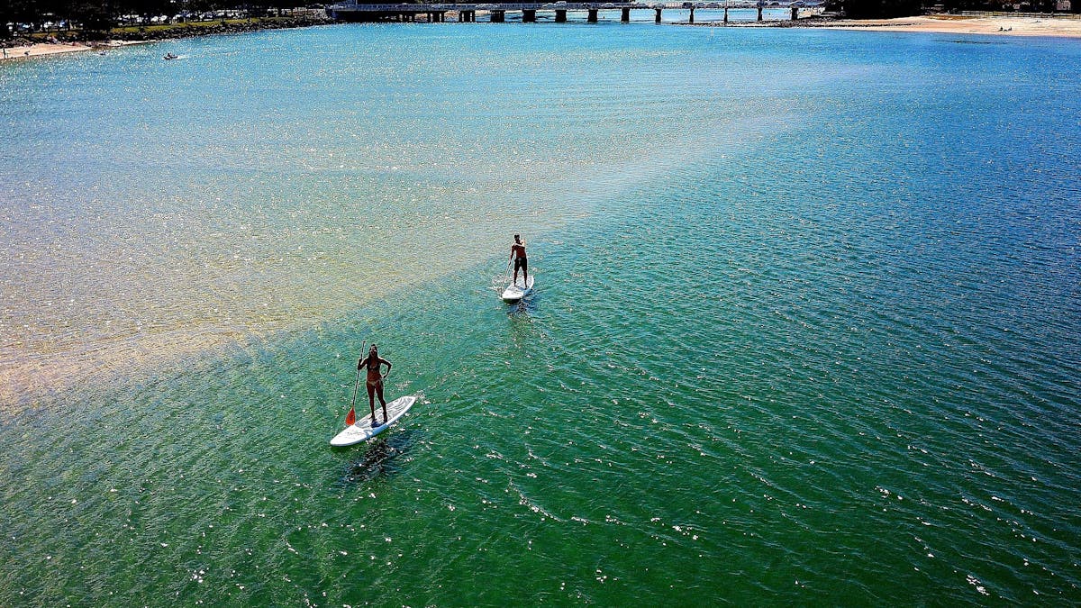 Stand up Paddle Boarding. All Coast Paddle Board Hire. Tallebudgera Creek, Gold Coast