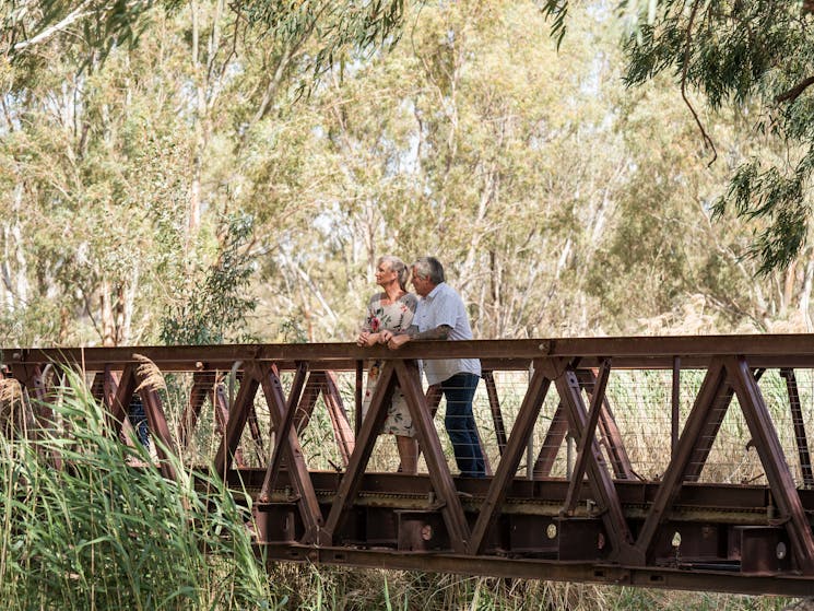 Couple on a bridge overlooking the Narrandera Wetlands