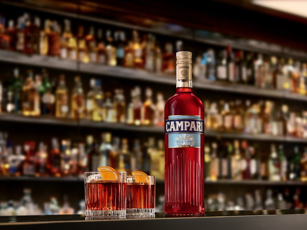 Photo of negroni and Campari bottle