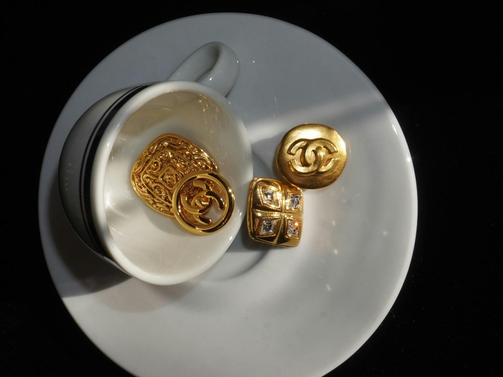 Gold Chanel Earrings In a Cup