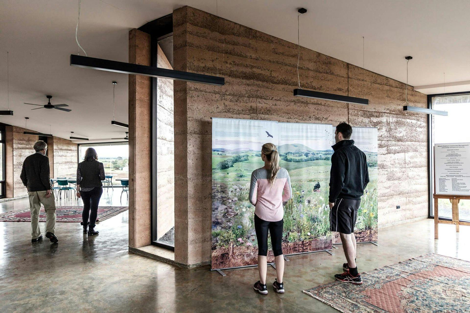 Visitors looking at artworks inside the Mount Elephant Visitor Centre