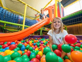 Indoor playground with ball pit, climbing frames and slides for children uner 6yrs