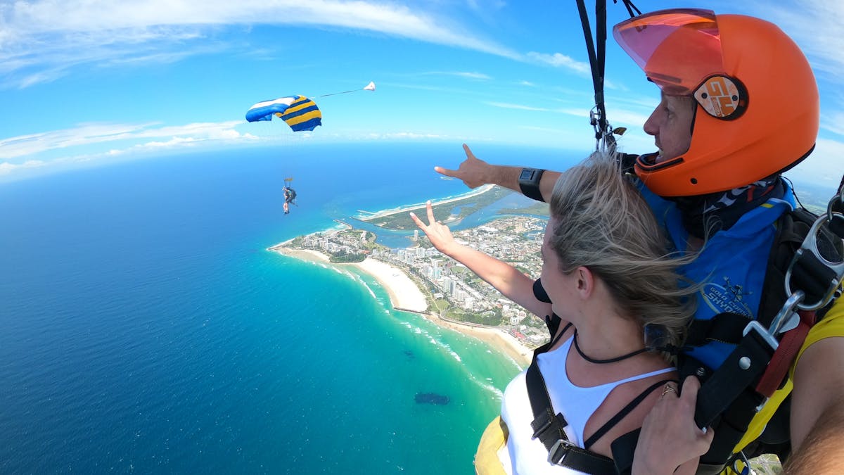 Tandem skydive under canopy coming to land Gold Coast beach