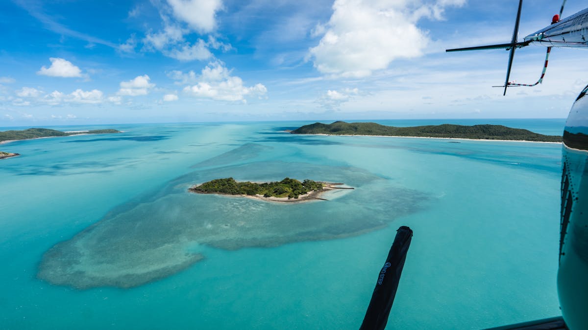 Coastal Rotors helicopter flying over the stunning Torres Strait Islands