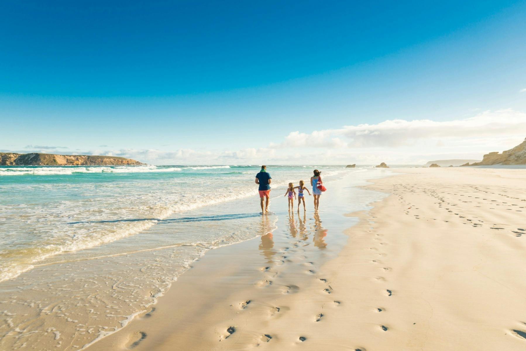 A family walk along the Almonta Beach shoreline