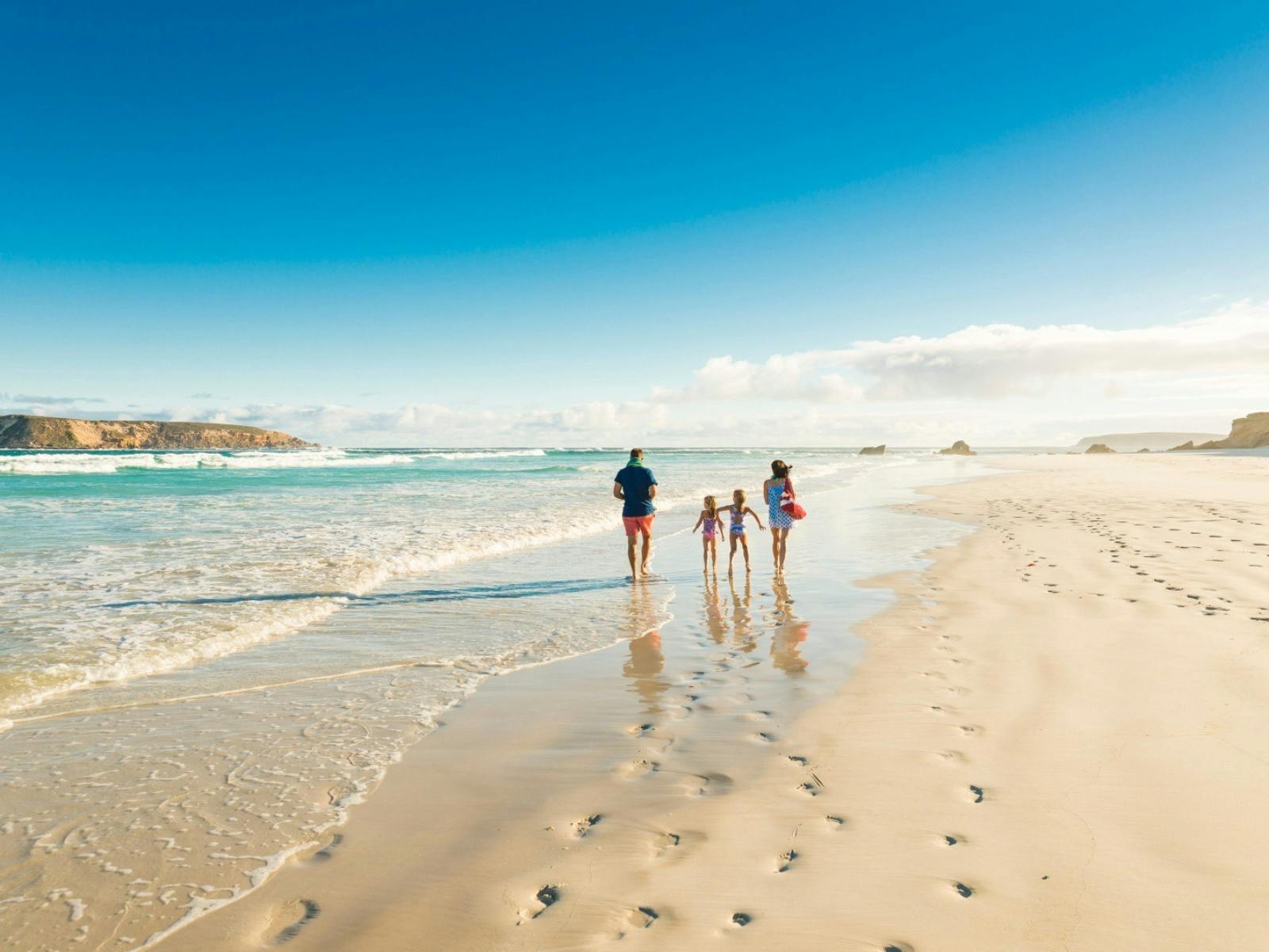 A family walk along the Almonta Beach shoreline