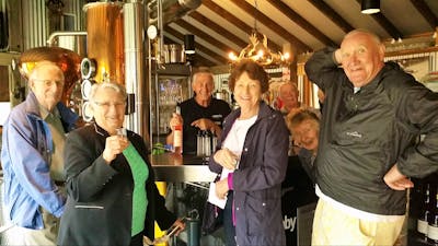 Six seniors in front of schnapps bar