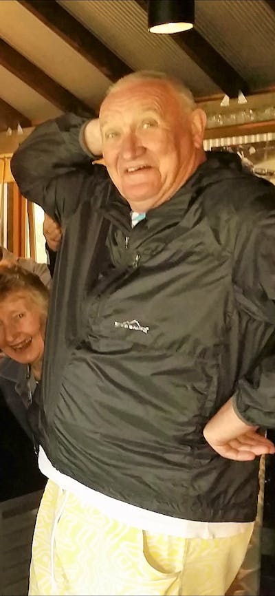 Six seniors in front of schnapps bar