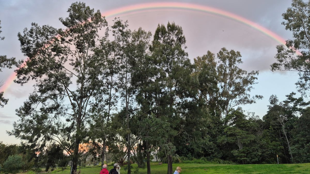 Rainbow during boomerang throwing lesson in Brisbane, Australia Rainbow during boomerang throwing lesson in Brisbane, Australia