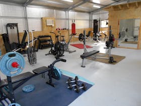 A gymnasium with different types of equipment