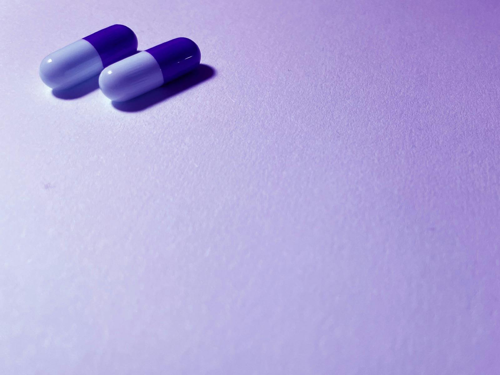 A photo of 2 purple tablets