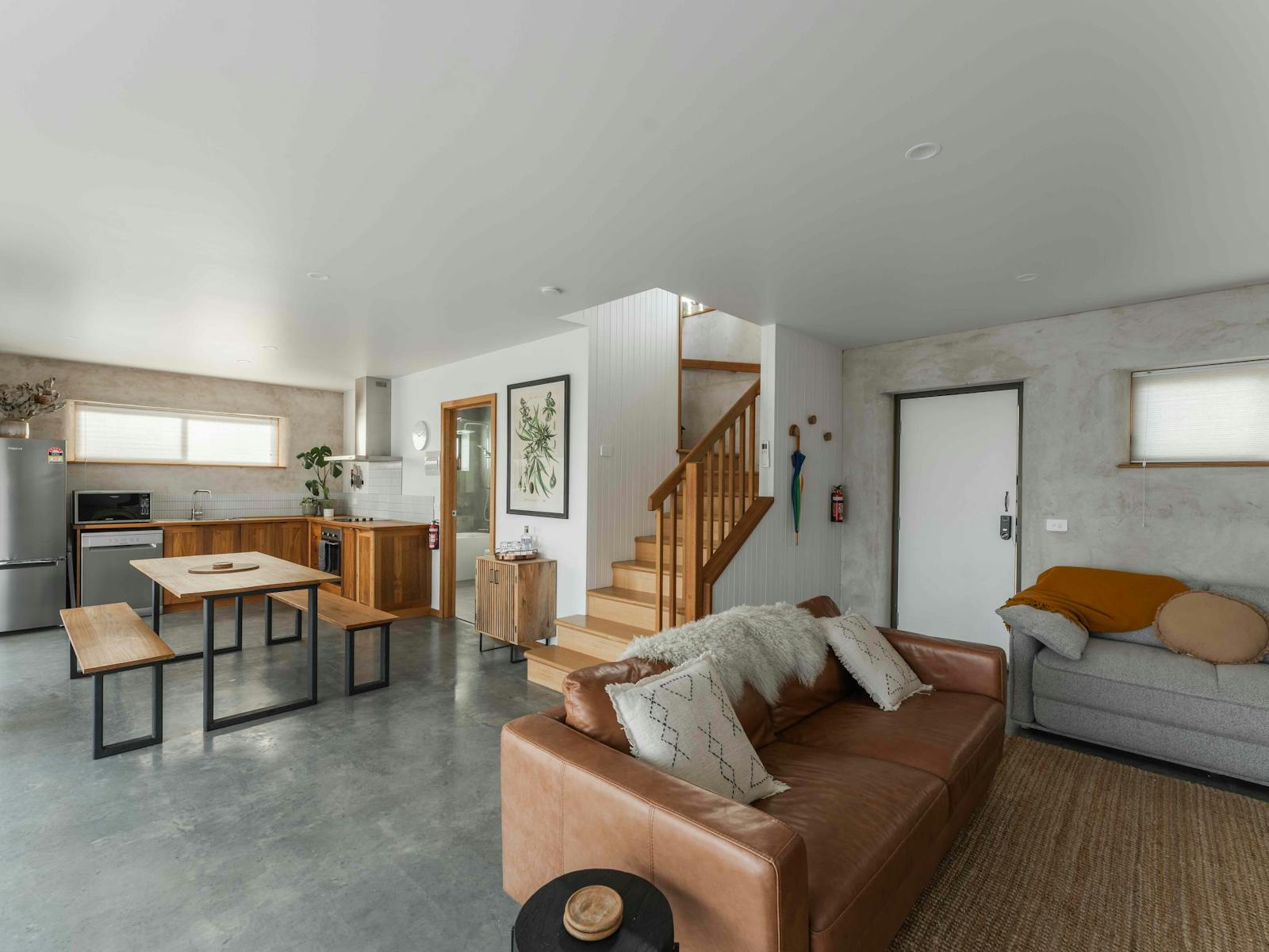 Two couches and a dining table.