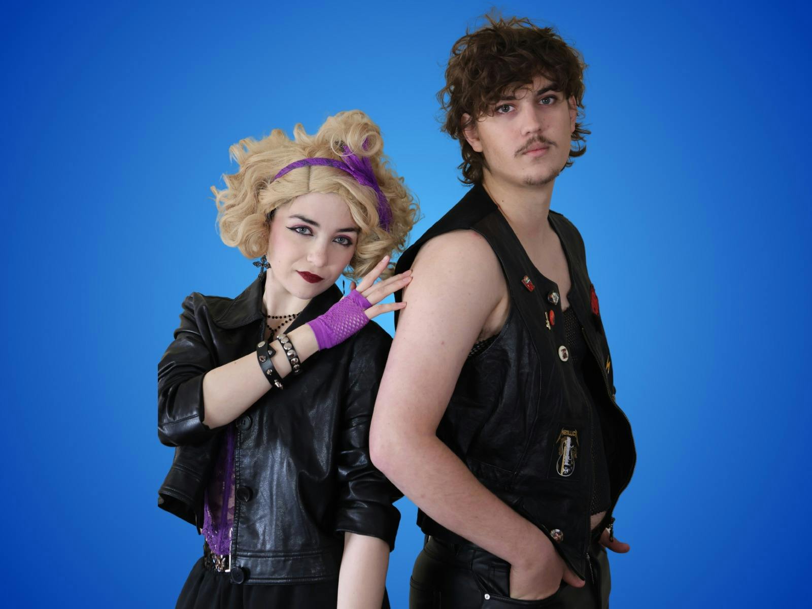 Sammy and Holly striking a cool pose with Sammy in black leather and Holly sporting big blonde hair