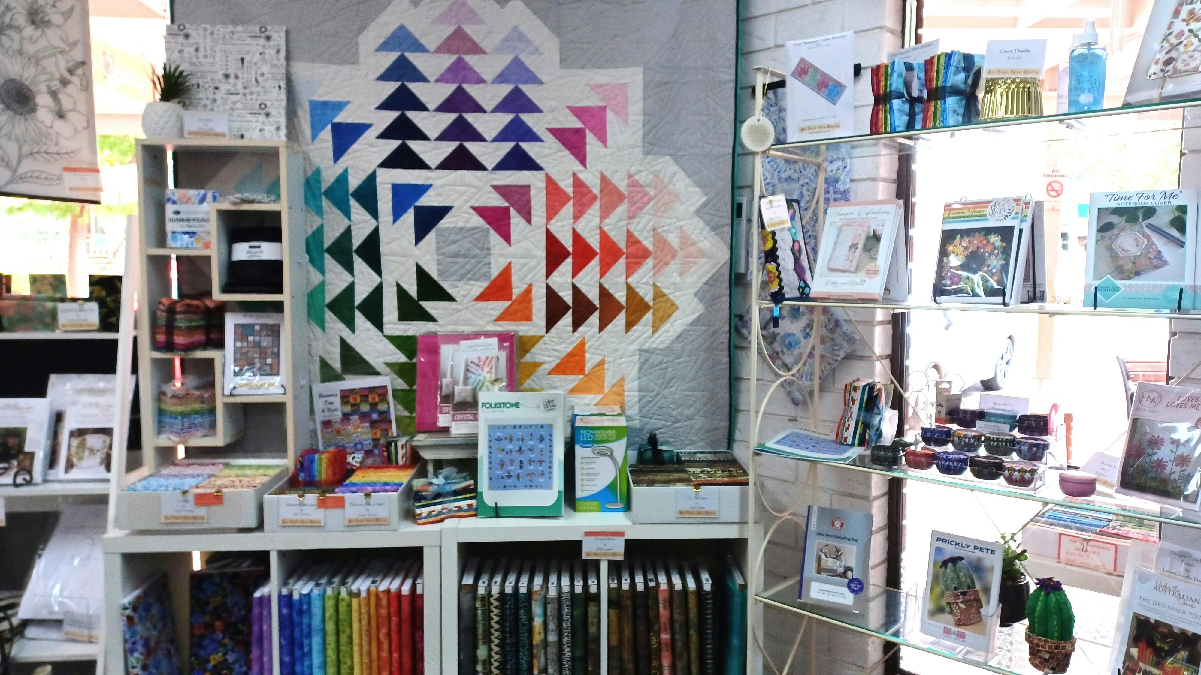 Fabric and patterns on display at Sew Bright Alpine Quilting