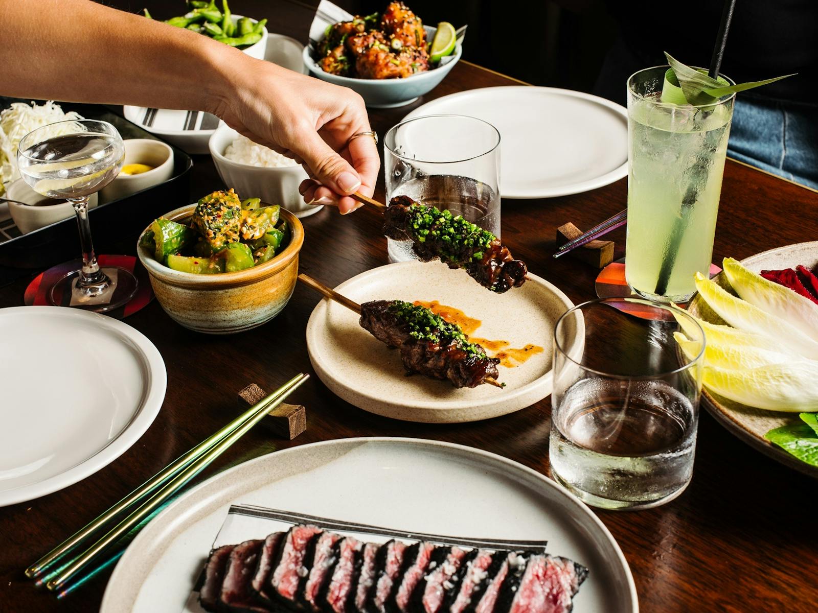 Hand picking up skewer