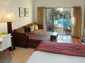 Queen suite with lounge room and flat screen television