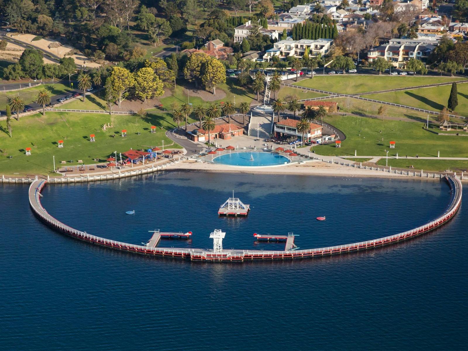 An aerial view of Eastern Beach reserve. walkway, pool and grassed area.