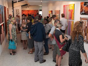 Image of the crowd looking at the artworks for the 2015 SALON des Refusés exhibition opening.