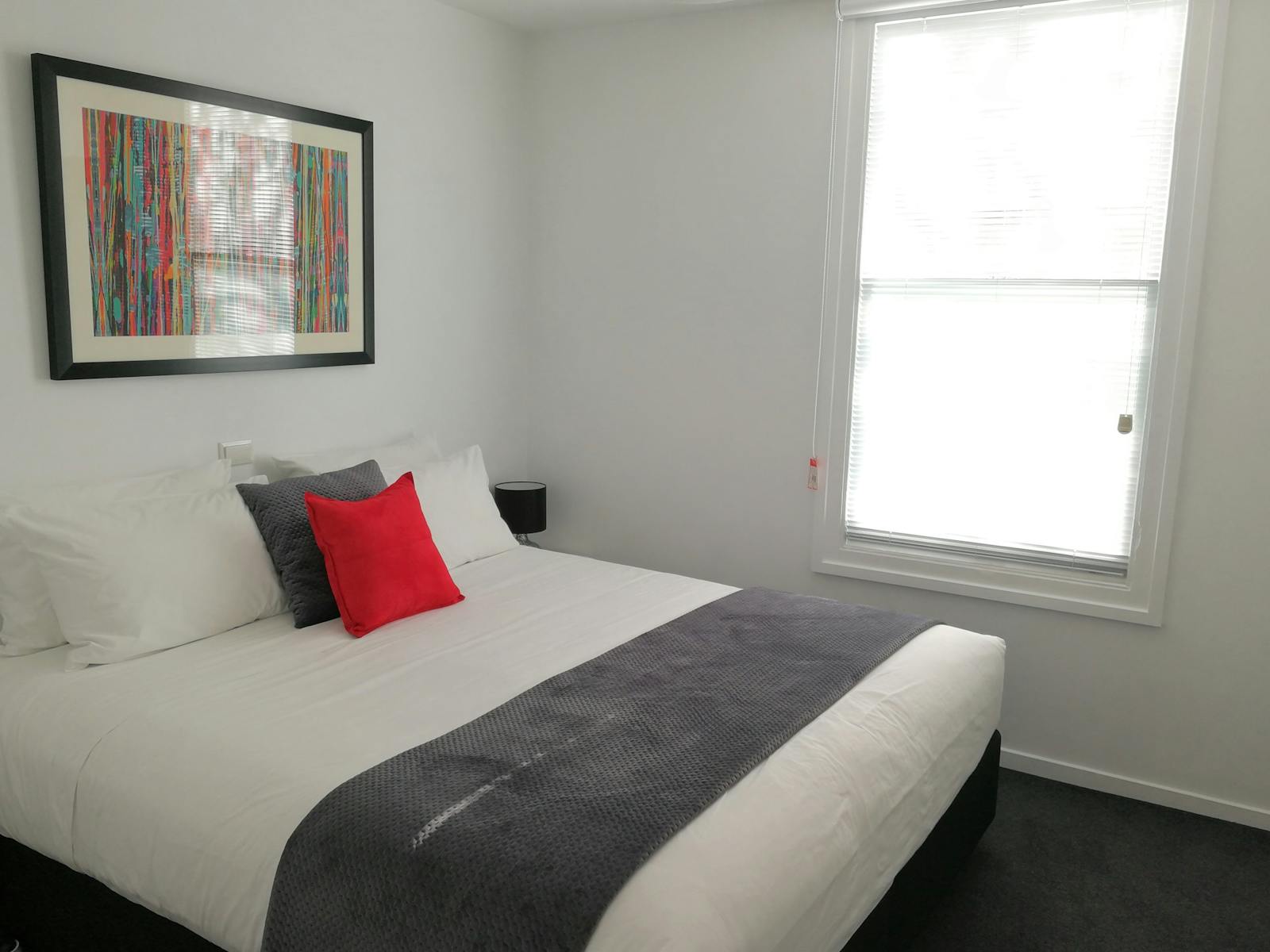 Second bedroom configuration: king bed (shown) or two single beds.