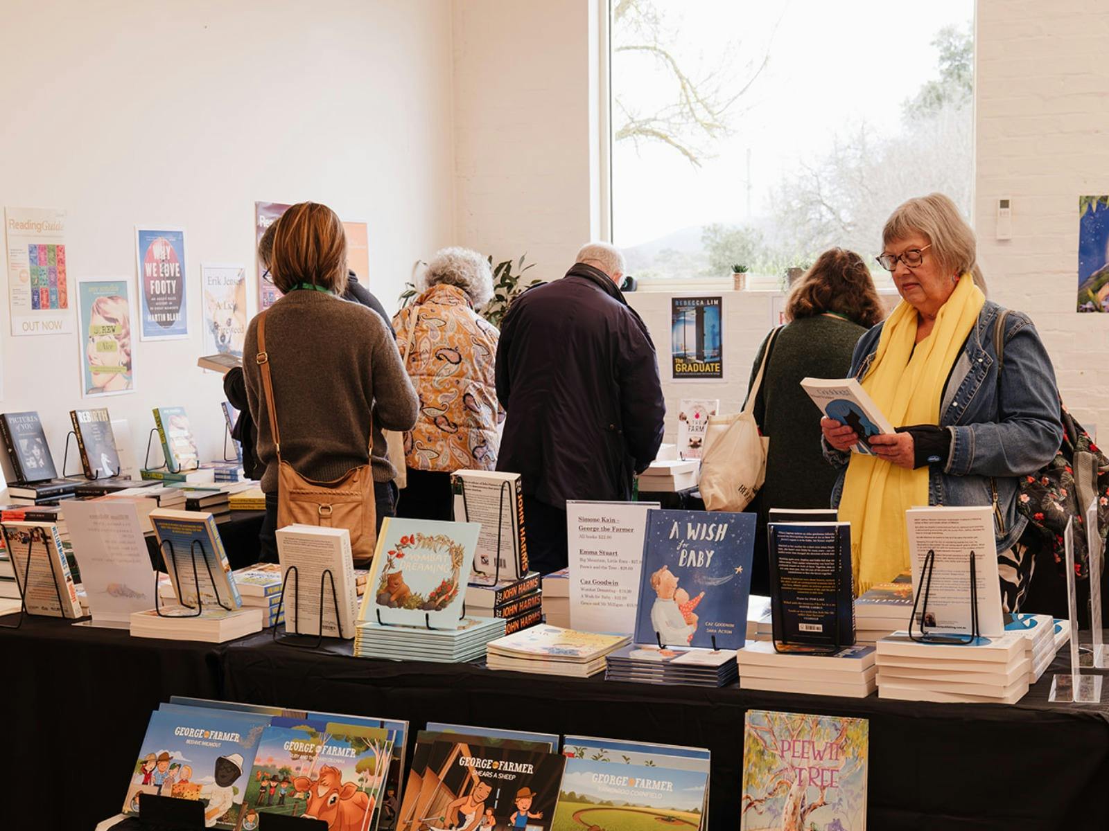 Customers browsing a festival pop up bookshop