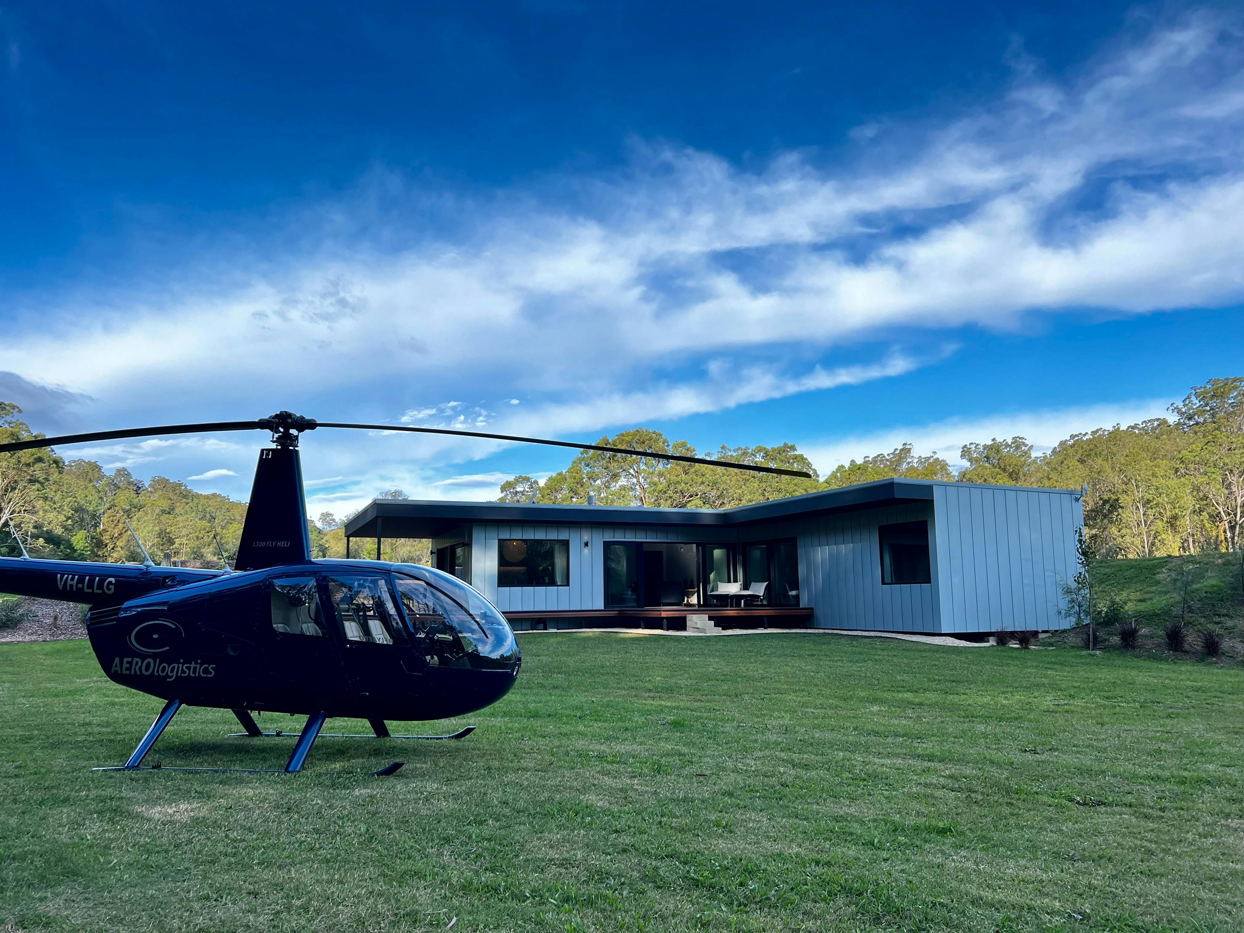 Helicopter landing in front of Villa