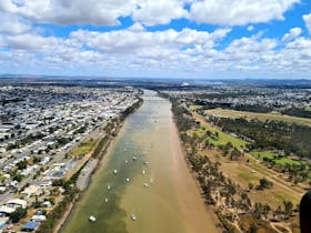 Photo looking down the fitzroy river with Rockhampton city on each side