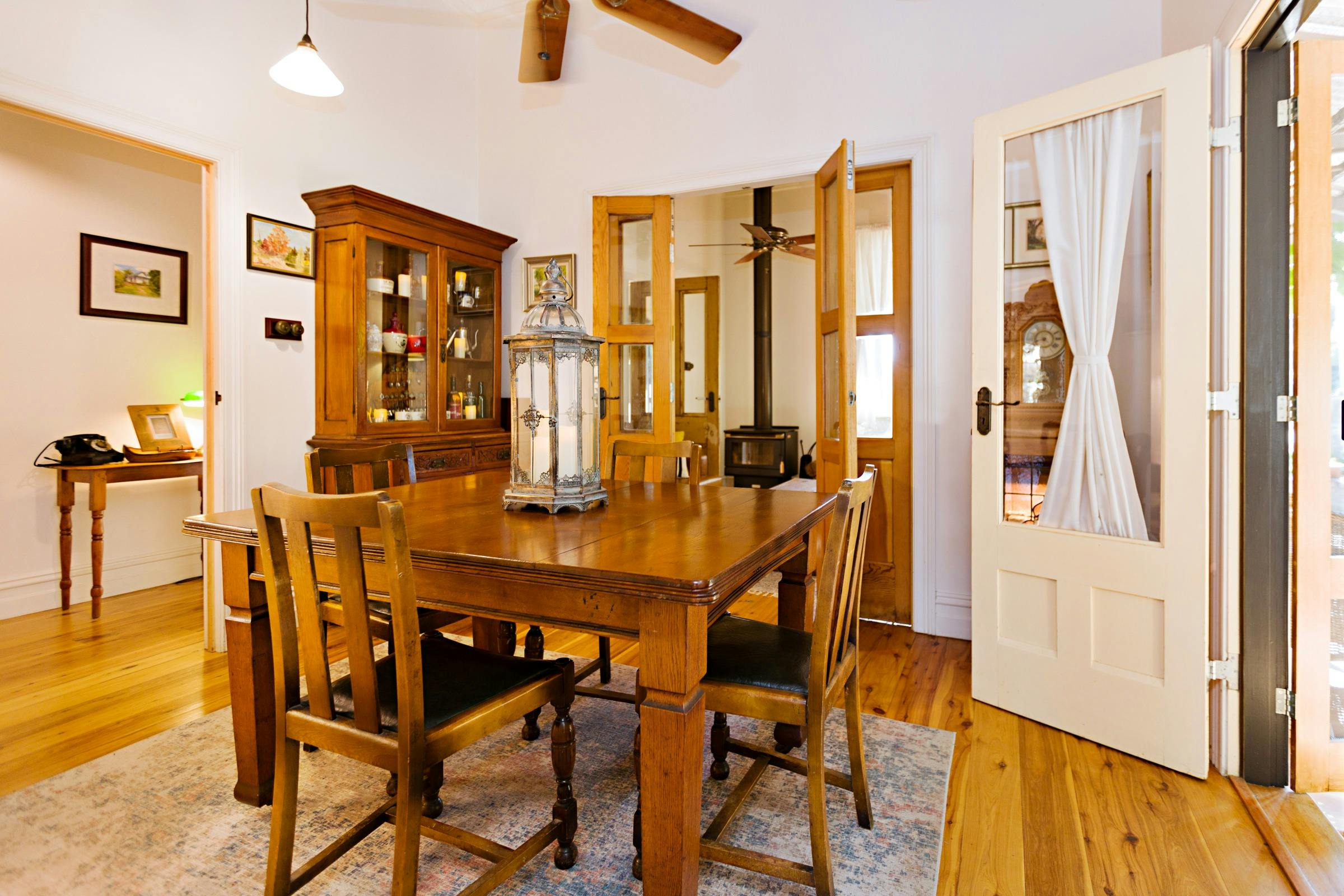 Opens out through french doors to vine covered canopy court yard
