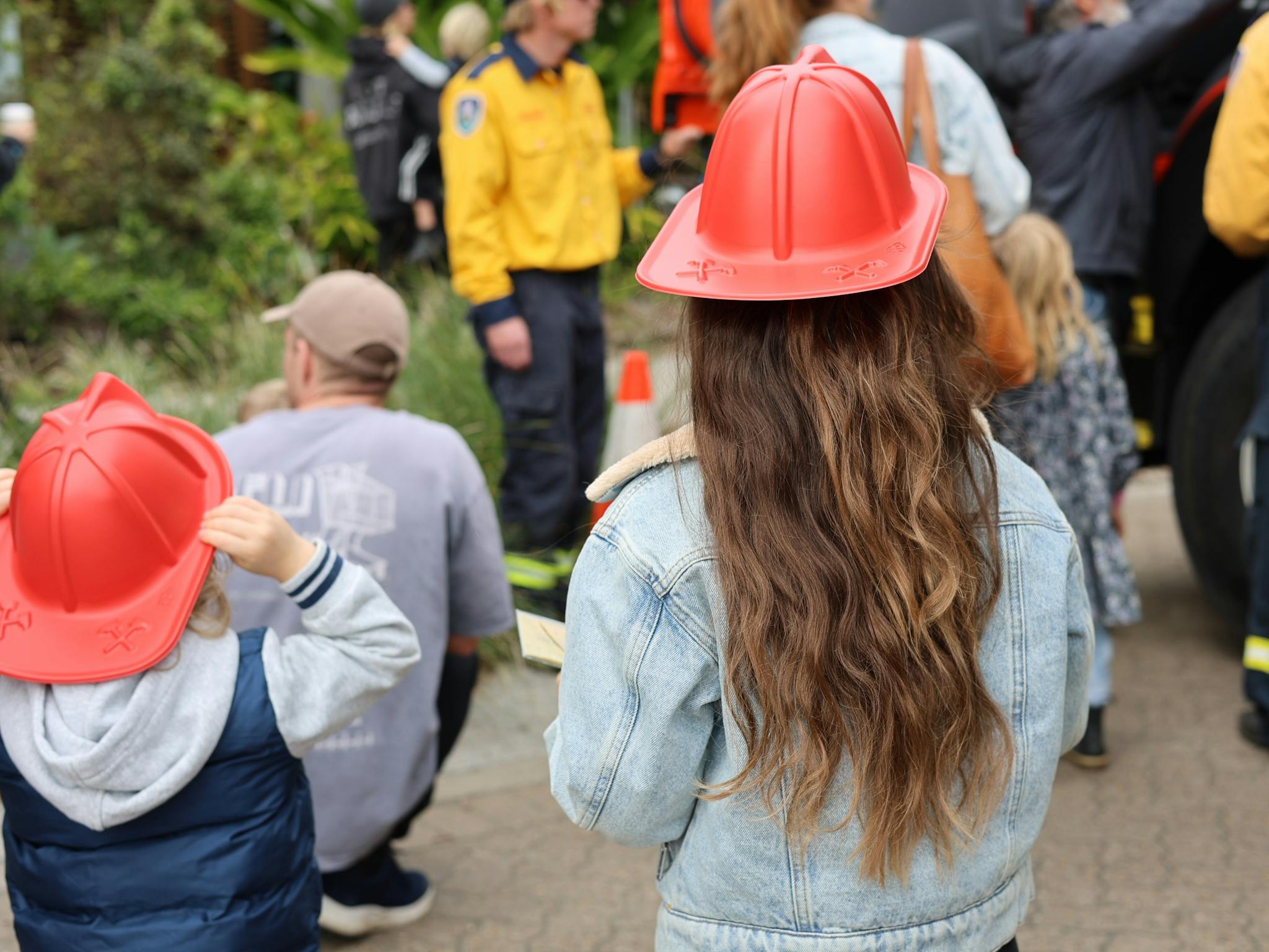 Children with fire helmets on