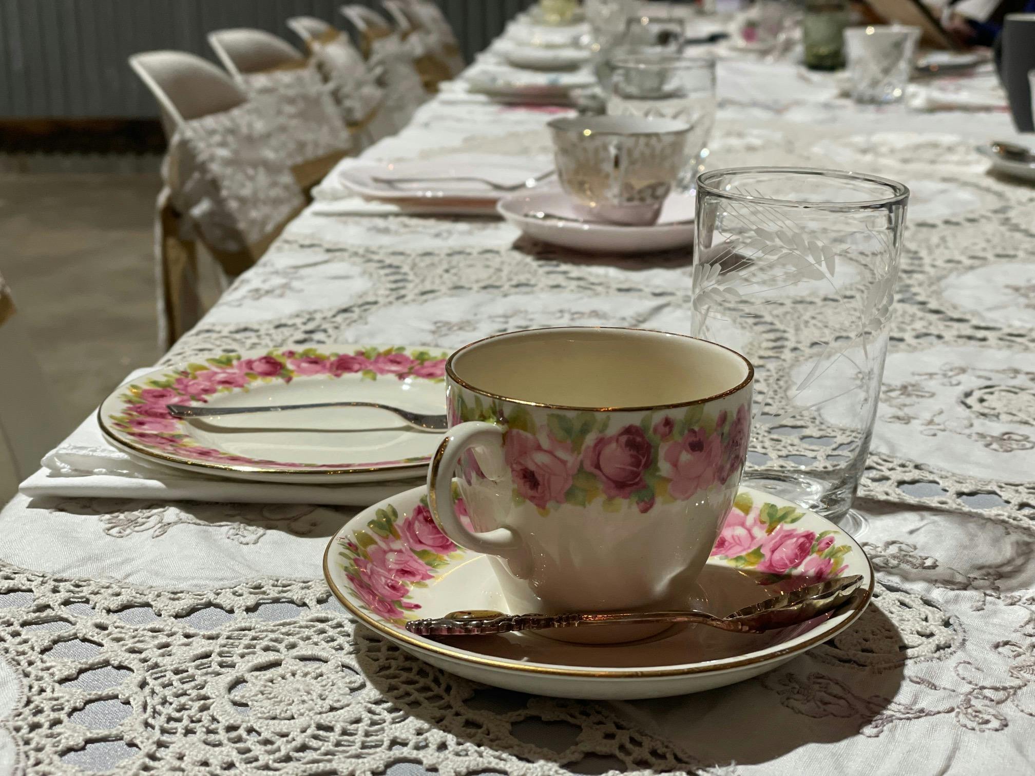 Beautiful pink floral teacup and saucer ready for the high tea.