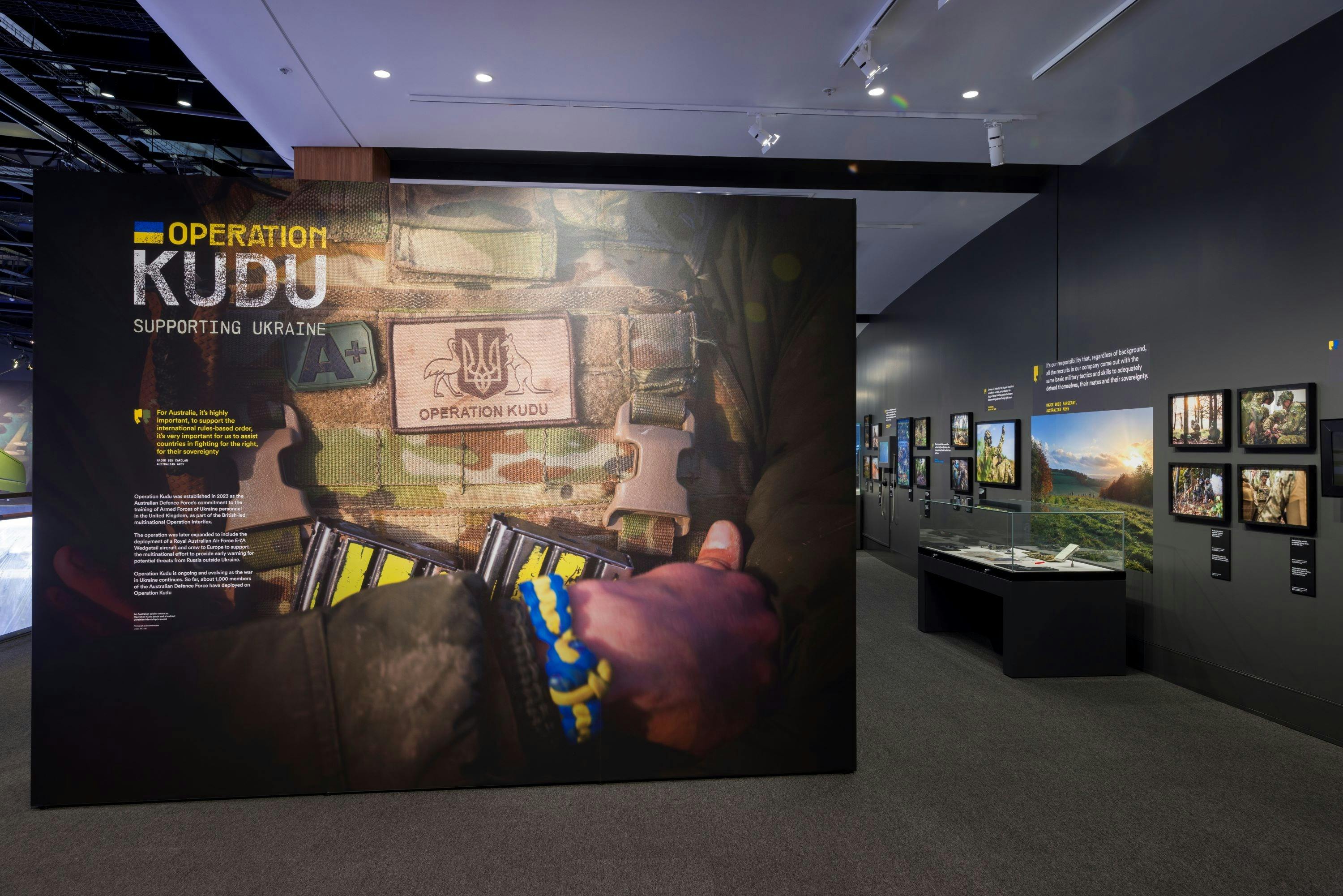 entrance to gallery with main photo of soldier in uniform, arms crossed