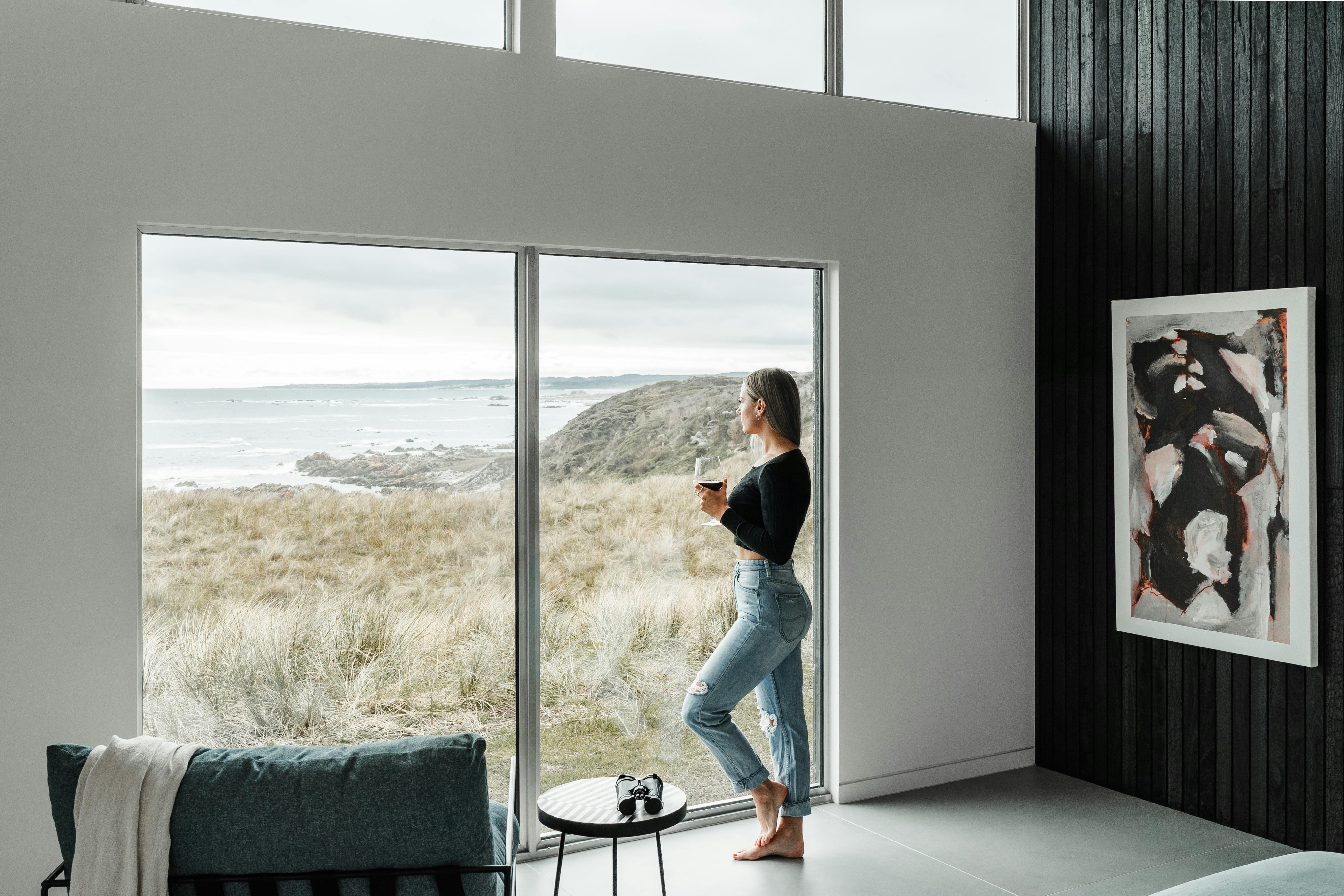 Standing at panoramic window enjoying the view