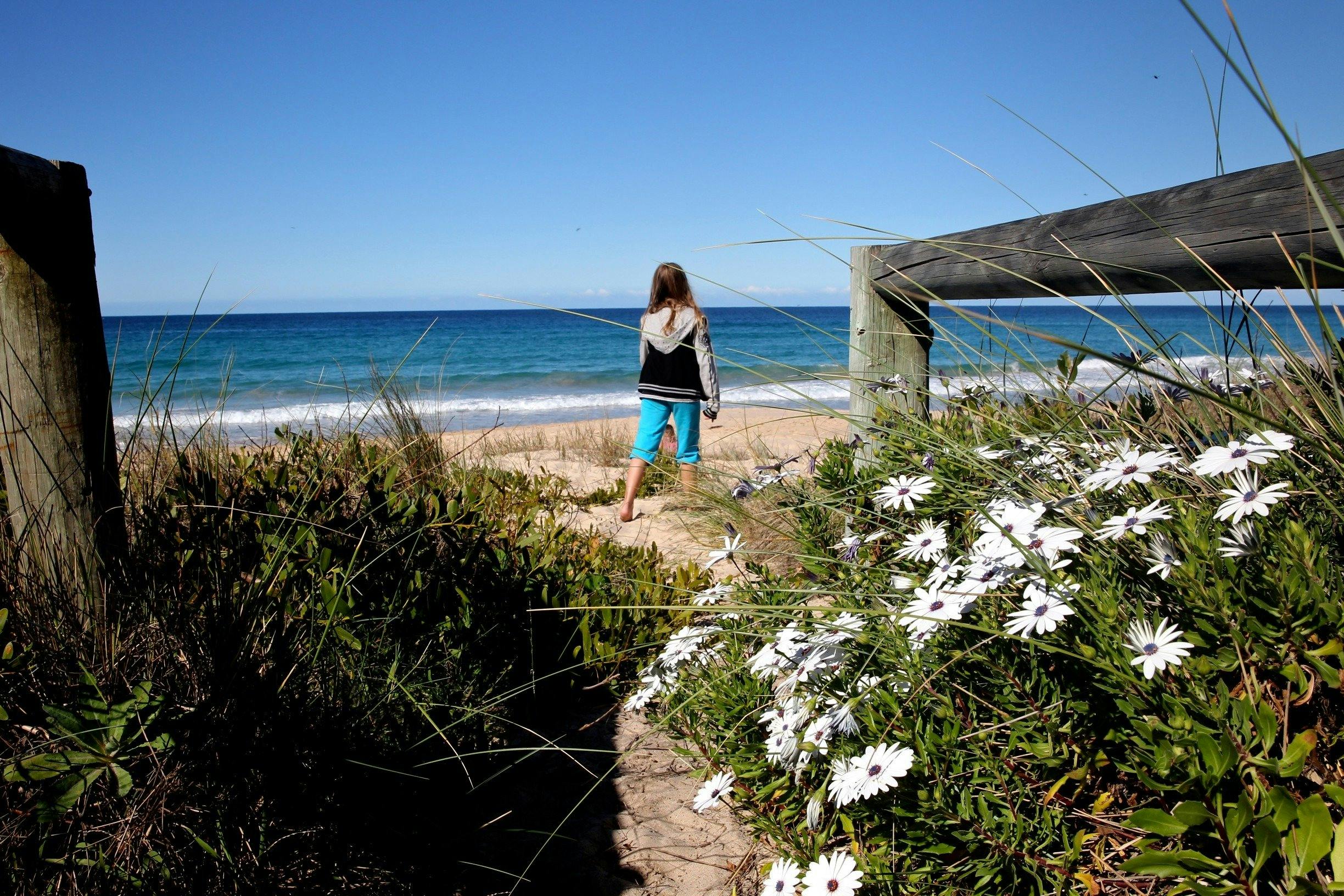 Absolute beachfront with private entrance to beach across level lawn