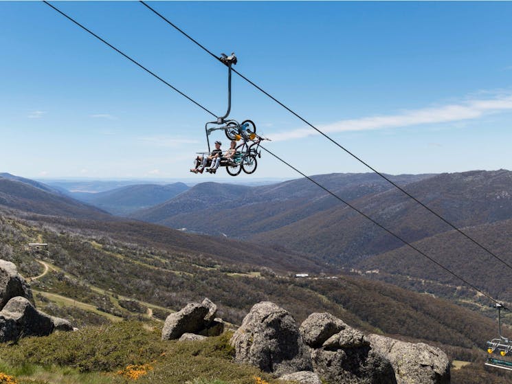 Mountain bikers taking a chairlift to the top of the Thredbo Valley Track