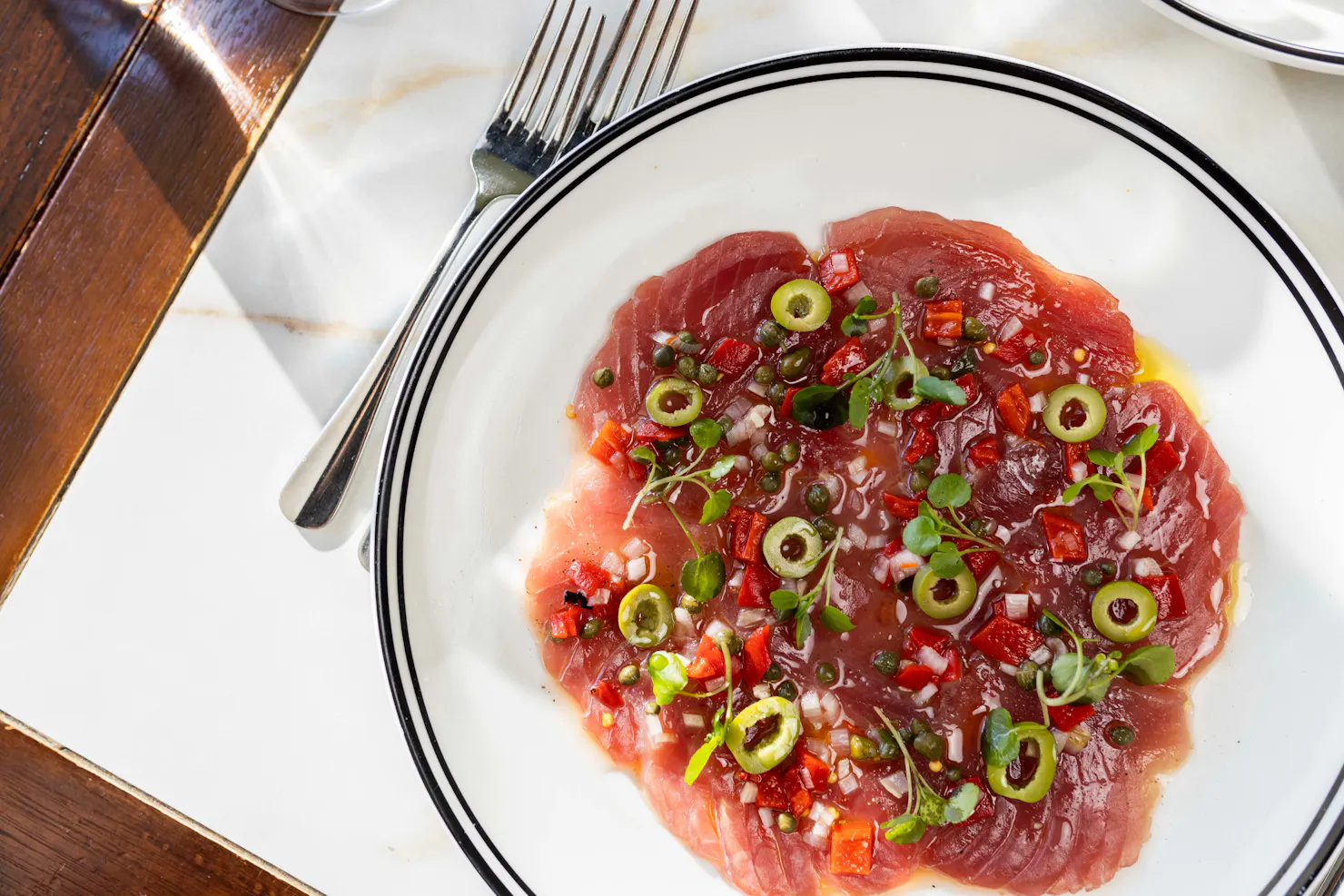 Yellowfin tuna carpaccio, ginger mayo, capers, roast capsicum, shallot, green olive