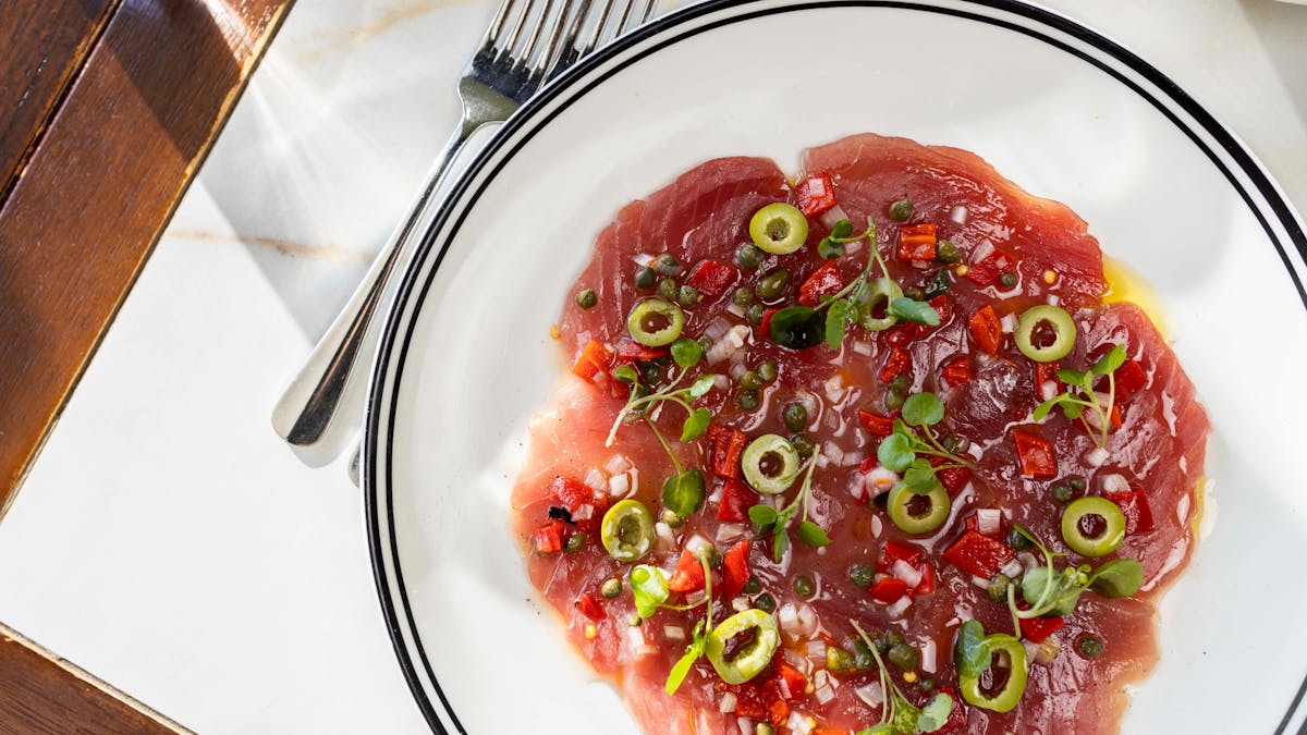 Yellowfin tuna carpaccio, ginger mayo, capers, roast capsicum, shallot, green olive