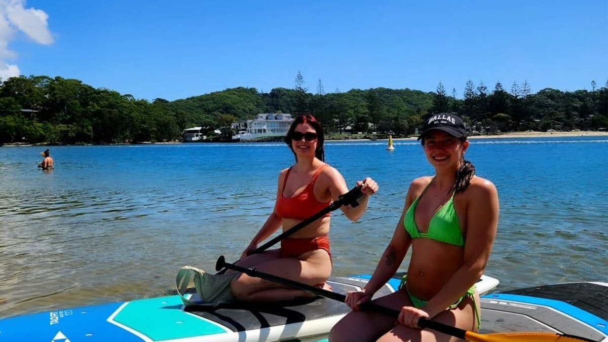 Ladies enjoying the blue sky and wonderful conditions, with All Coast Paddle Board Hire.
