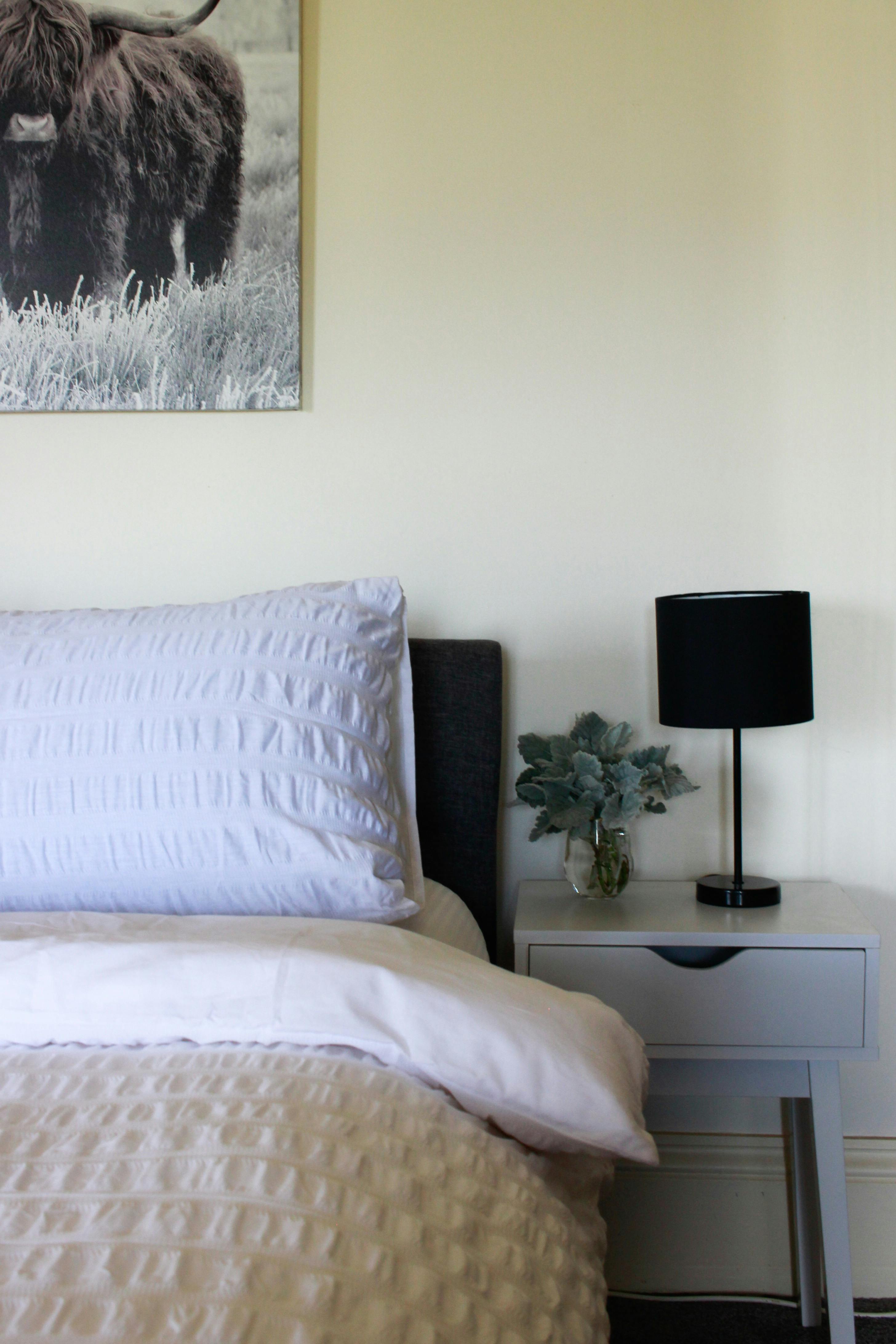 Bedroom 1's comfortable queen bed - a great place to lay and look over the farm