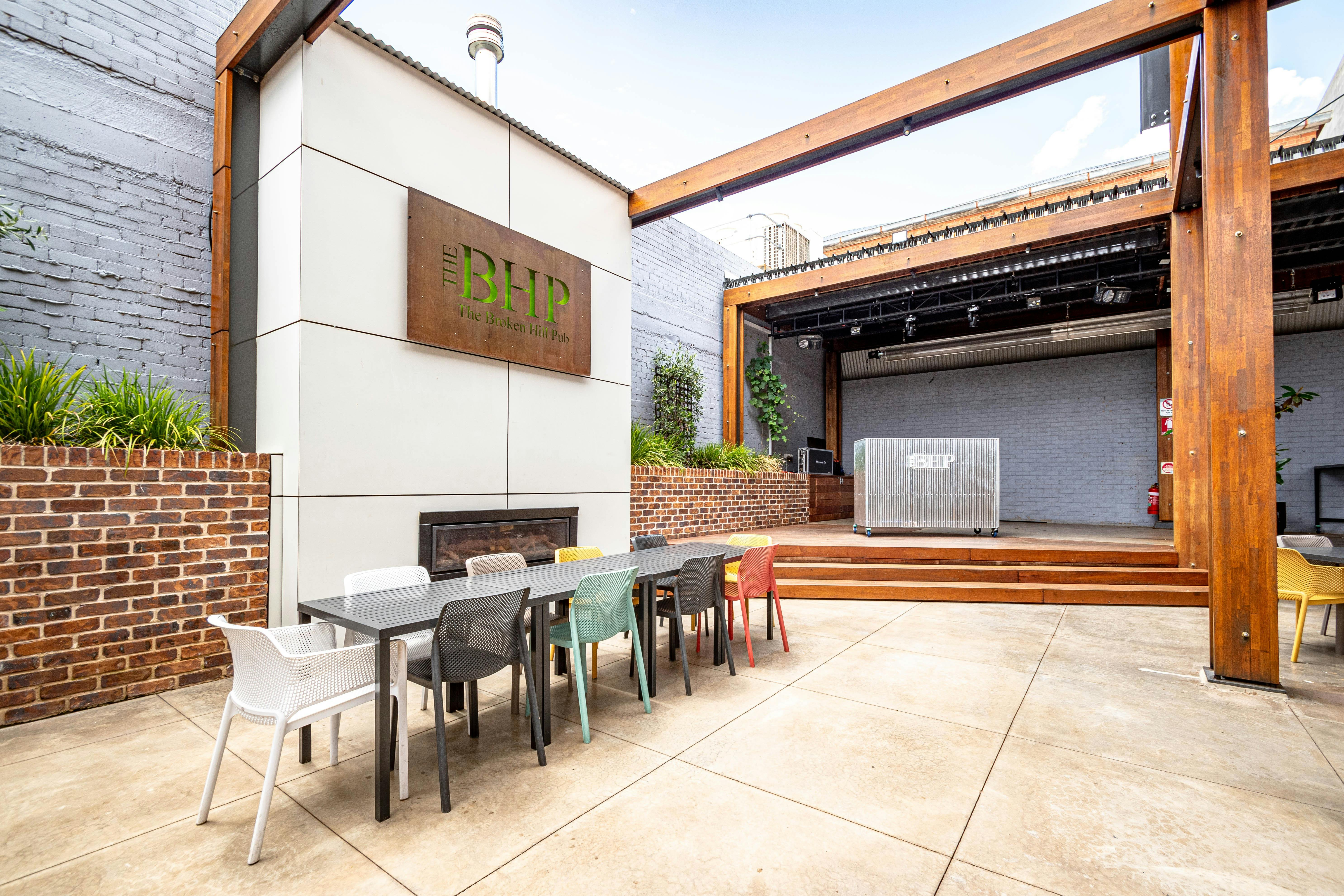 The outdoor beer garden of The Broken Hill Pub showing the permanent stage set up.