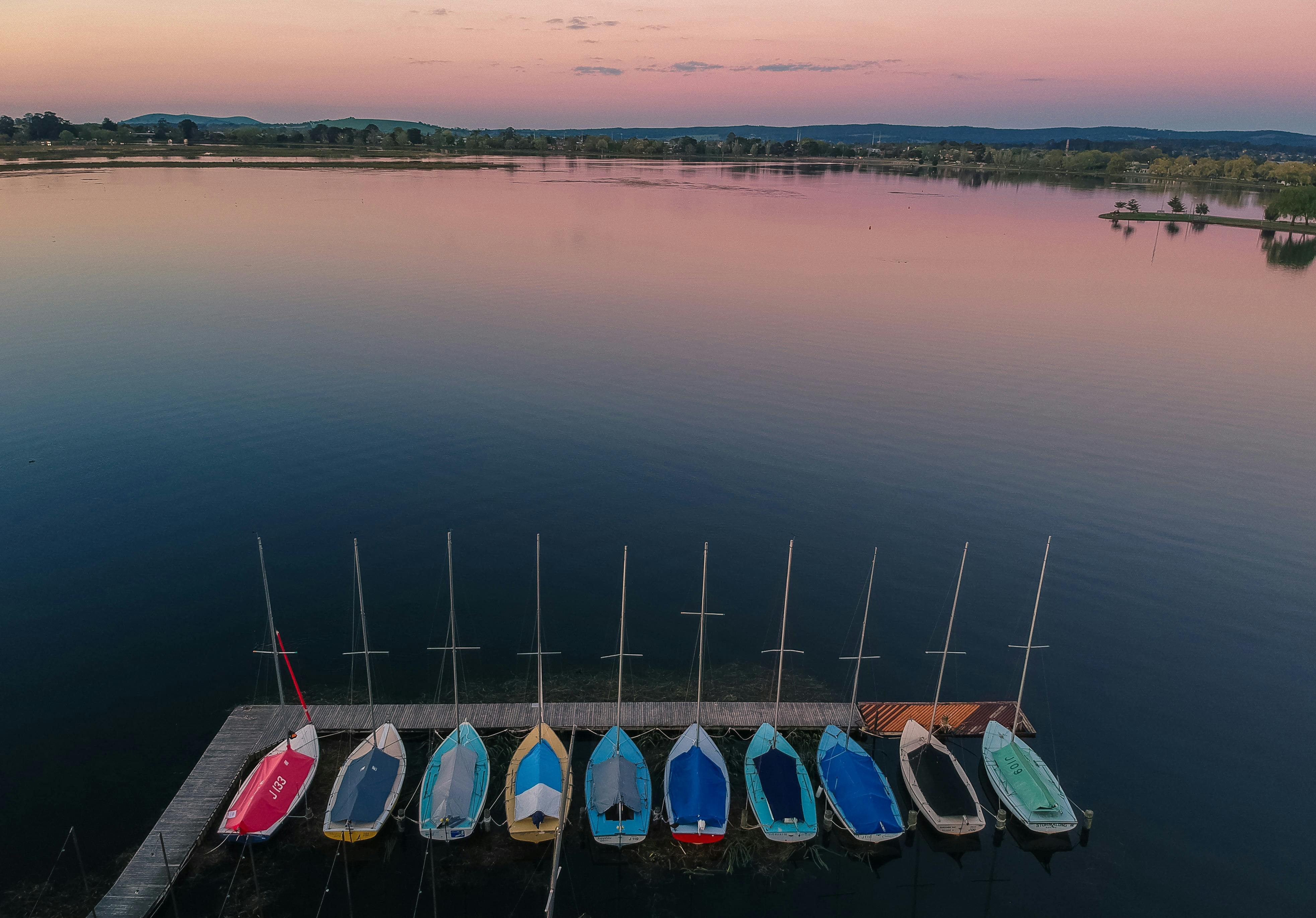aerial view of colourful boats in dock on lake wendouree