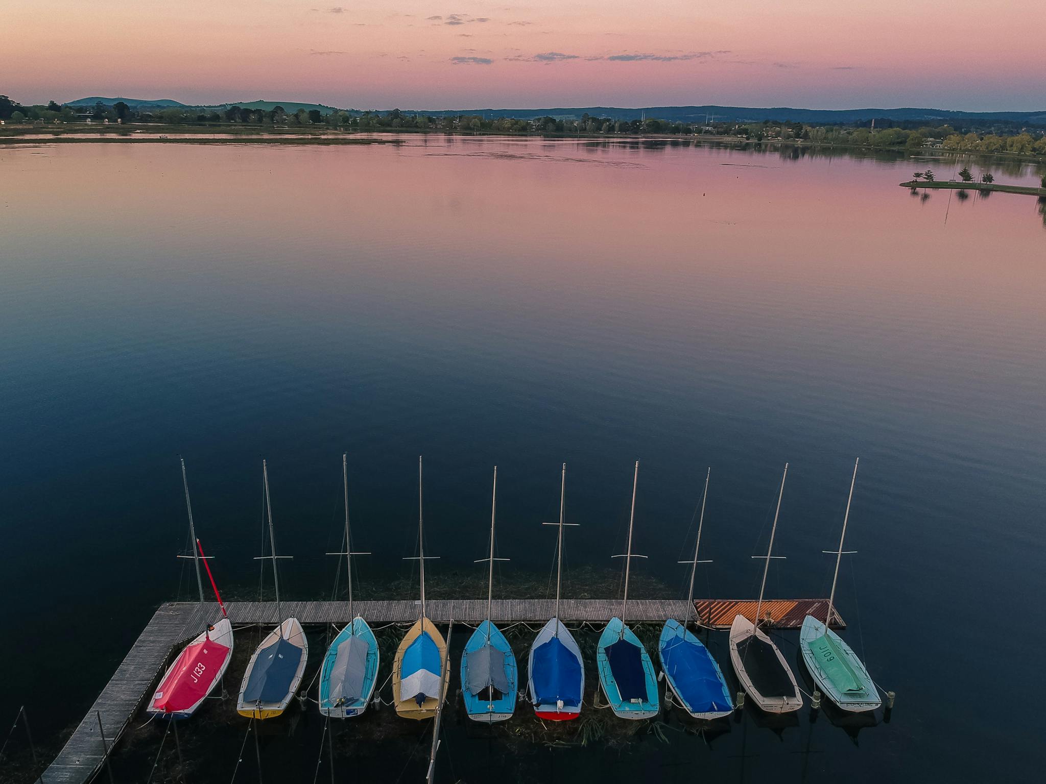 aerial view of colourful boats in dock on lake wendouree