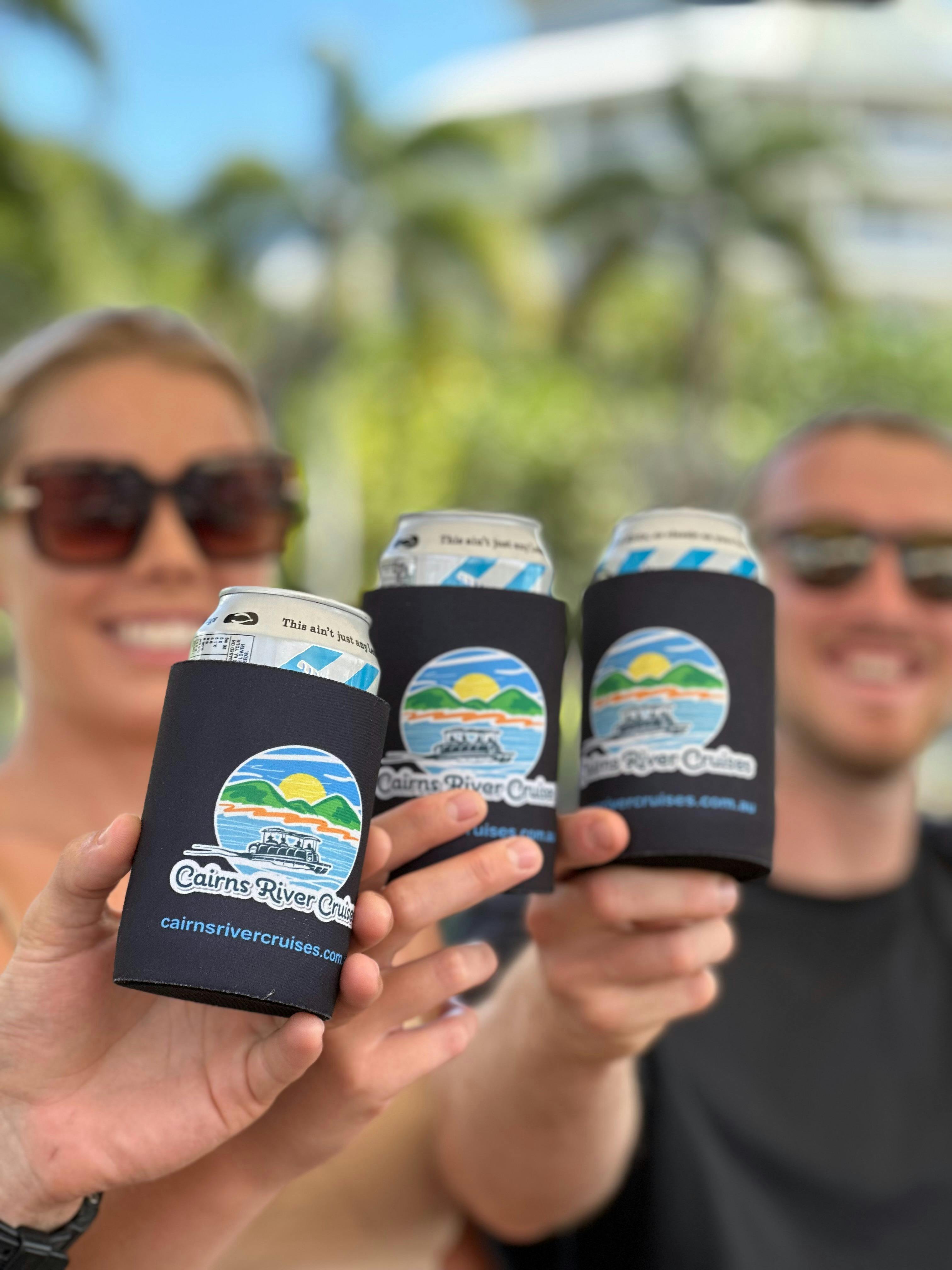 Friends cheersing complementary drinks in Cairns River Cruise Koozies