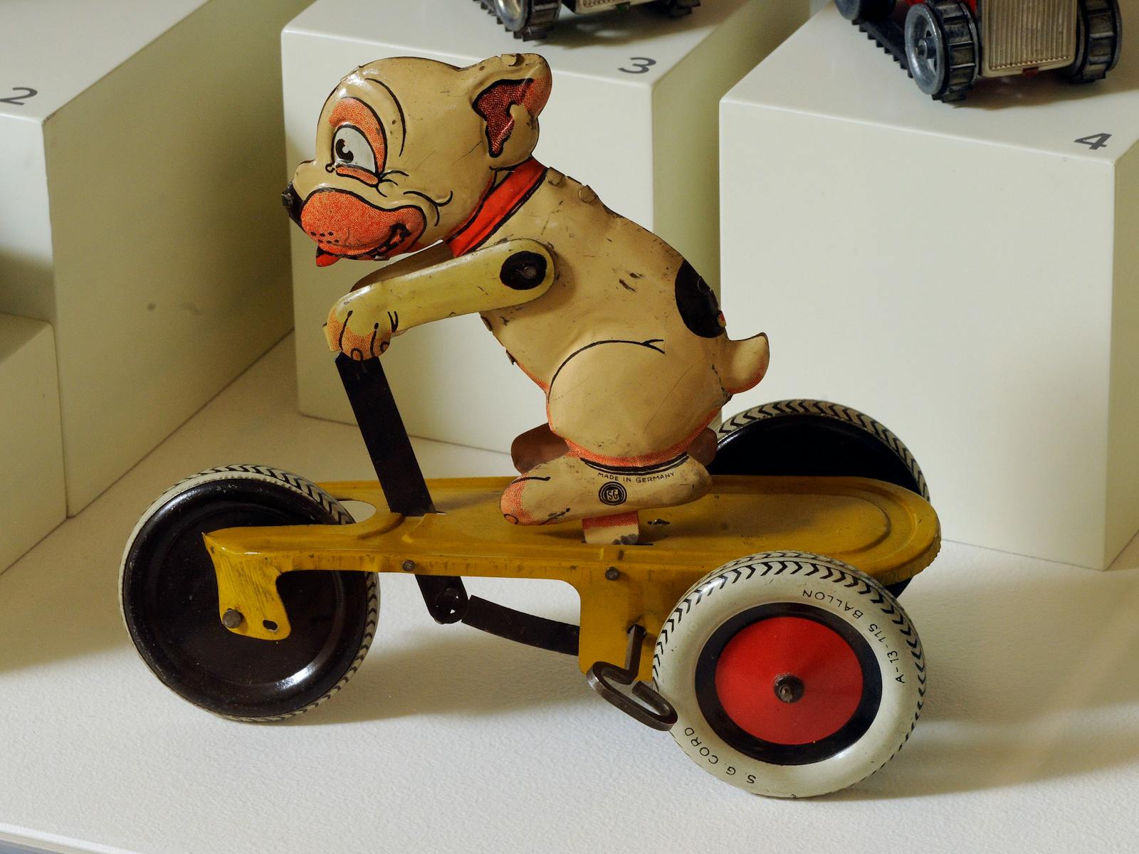 Tin toy c1930, dog on a motor bike, owned by Henry Baldwin (1919-2007)