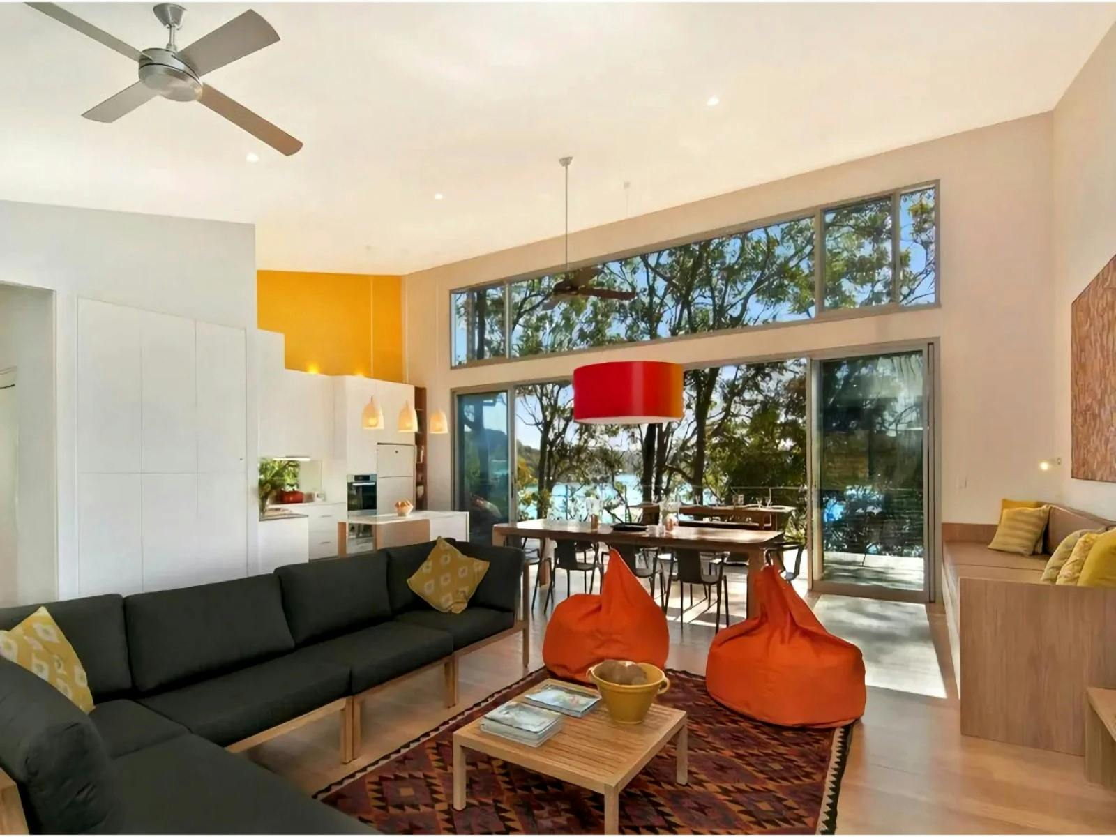 open plan living area has an open fireplace with a gourmet kitchen/dining area