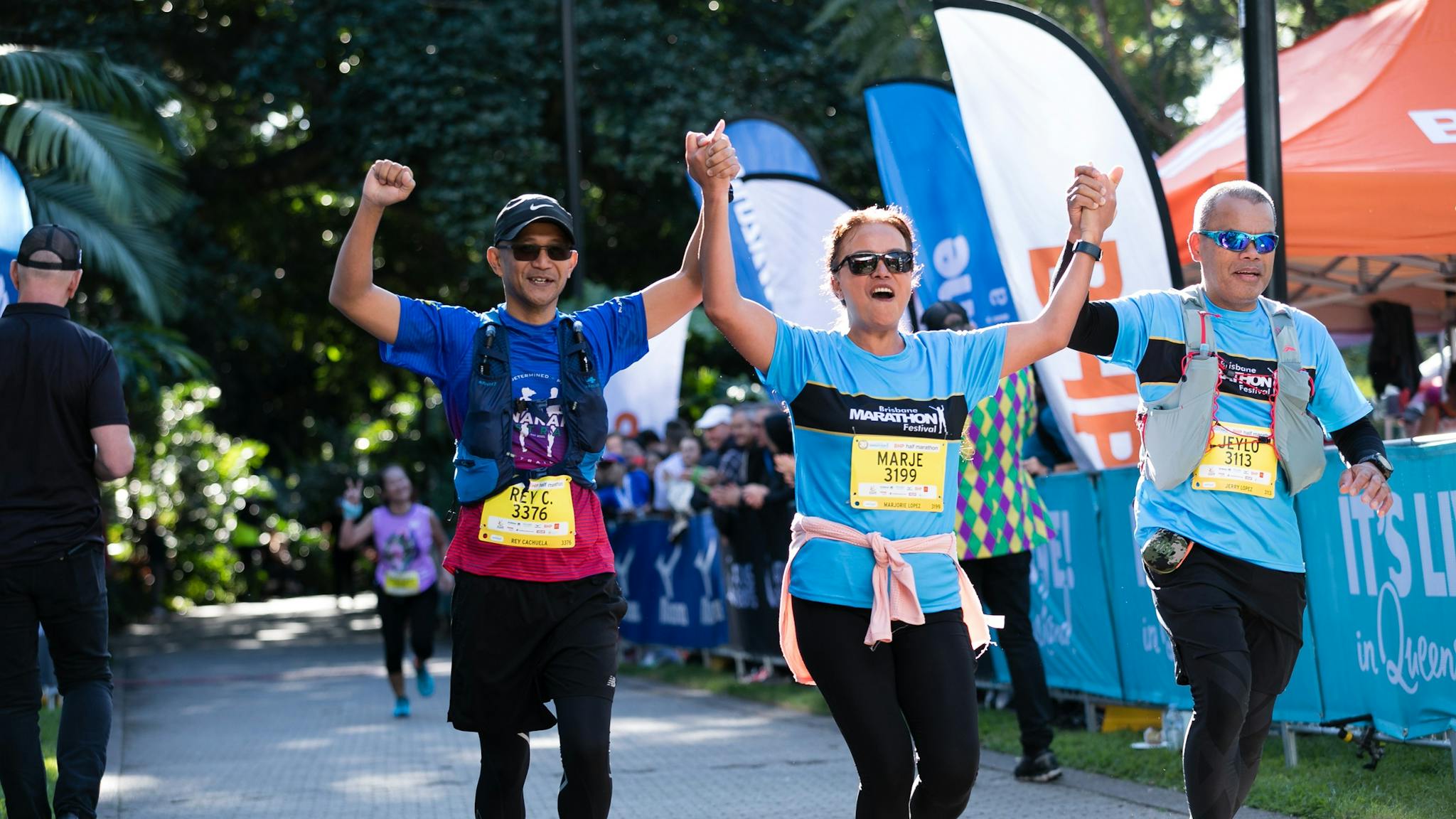 runners finishing run and crossing the finish line runners finishing run and crossing the finish line