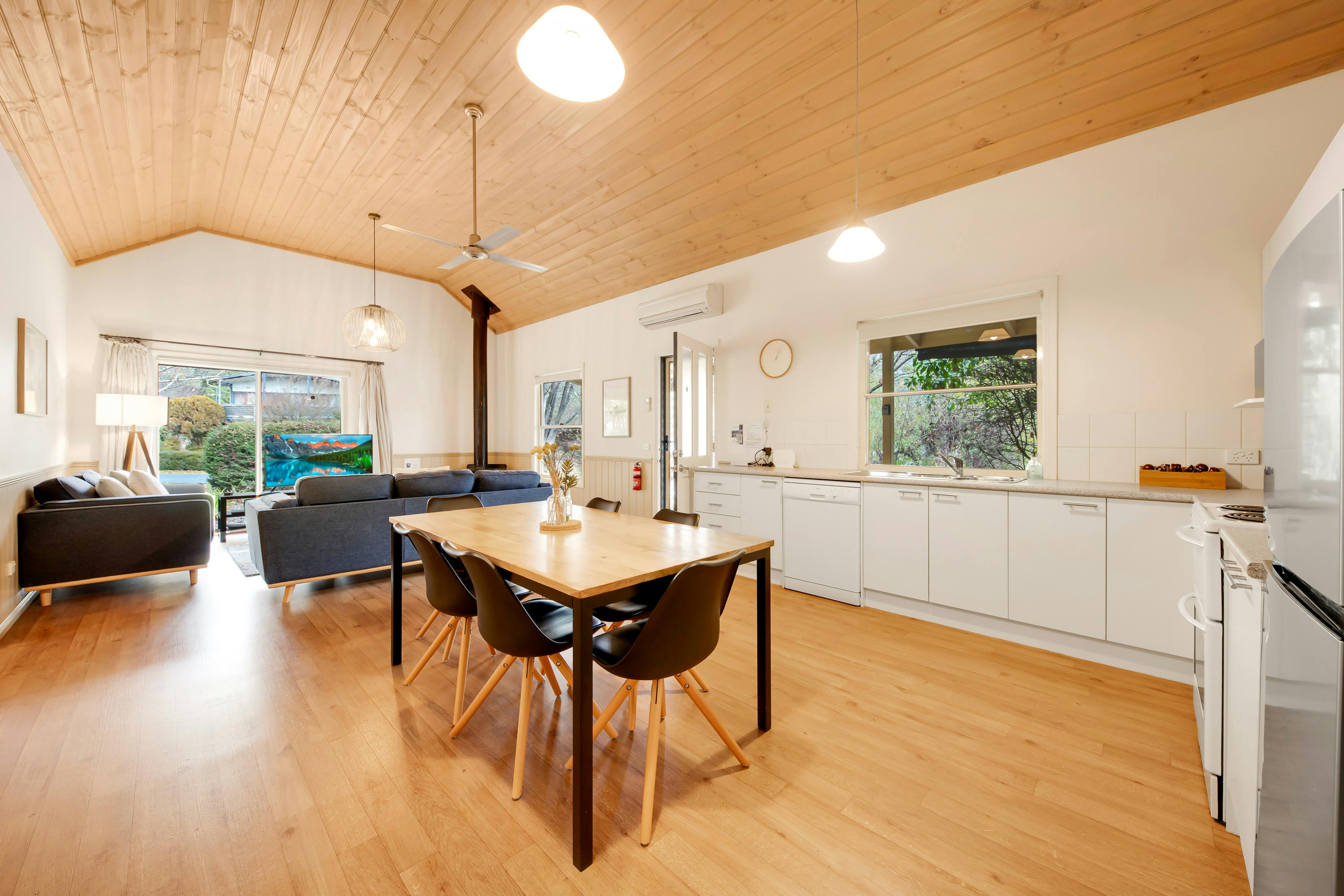 kitchen and dining area with lounge room in the background