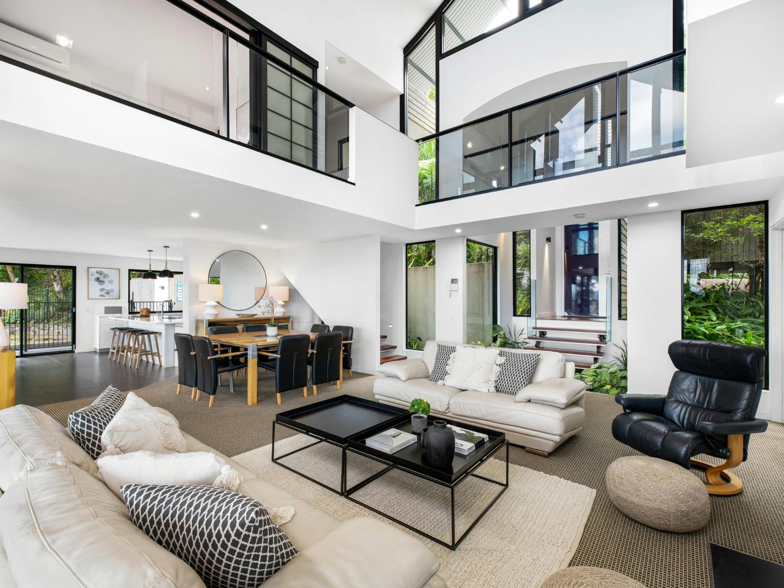 Open plan living and dining with balcony access